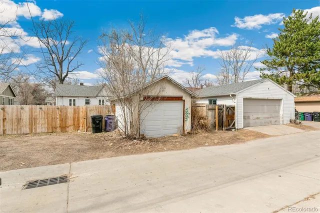 a view of a house with a yard and garage