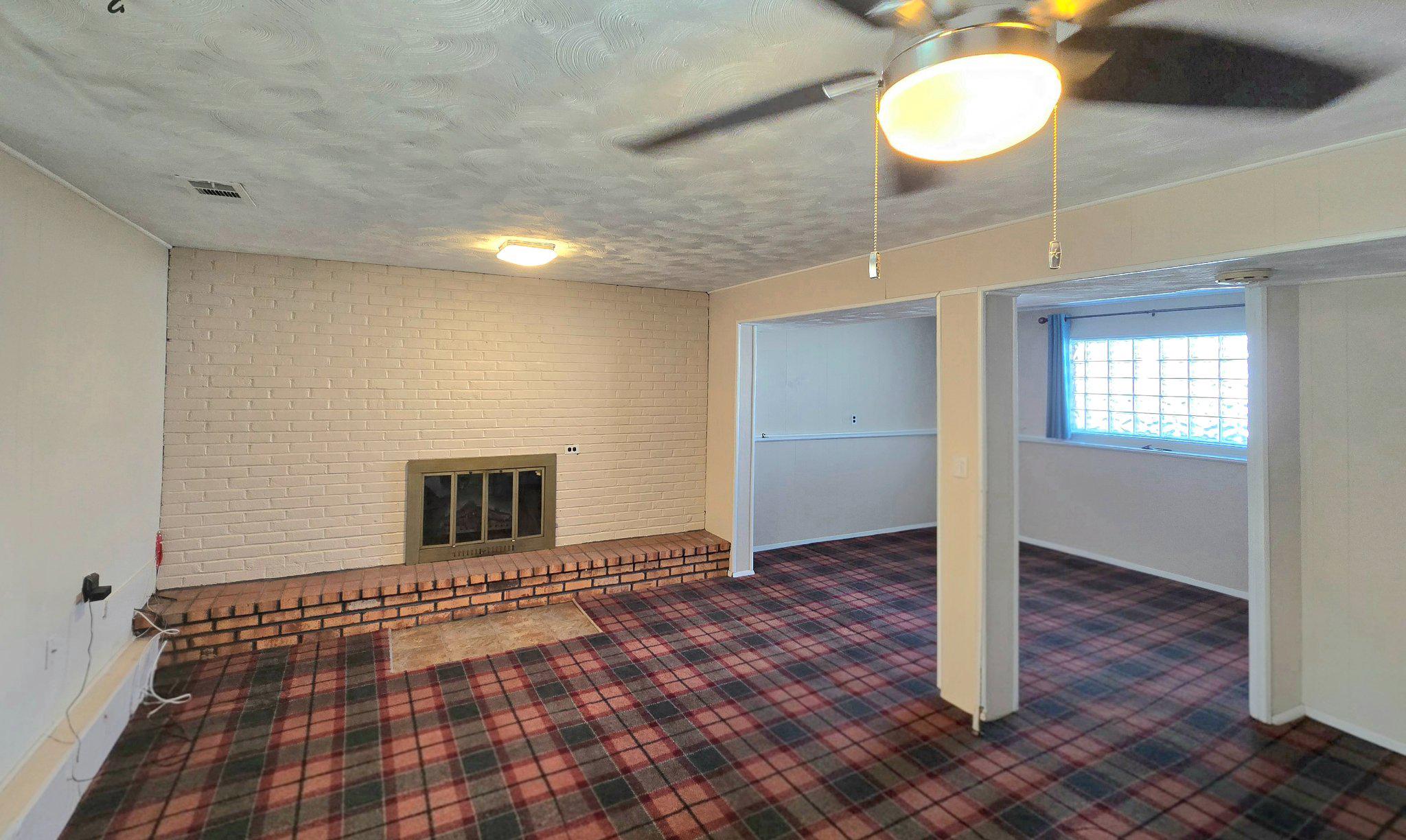 8819 Sonya Road Randallstown, MD 21133 - Photo 19 of 28 Lower level family room and fireplace