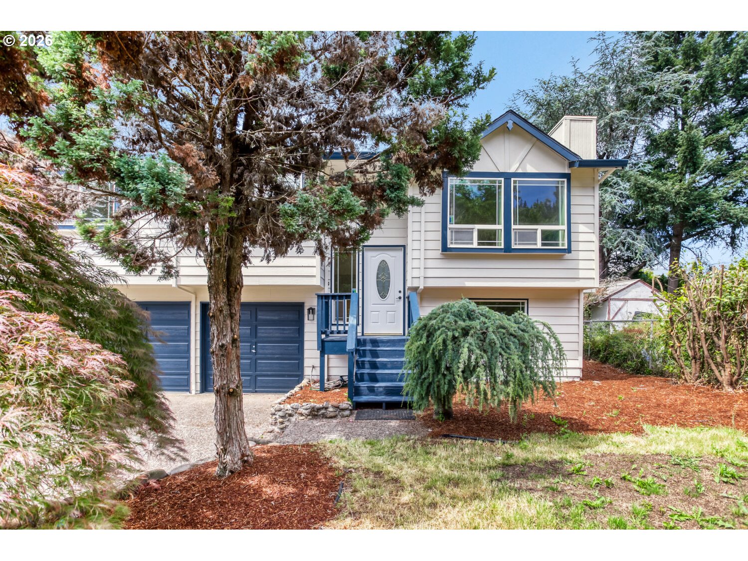 14539 Southeast Center Street Portland, OR 97236 - Photo 2 of 30 a view of a house with a yard
