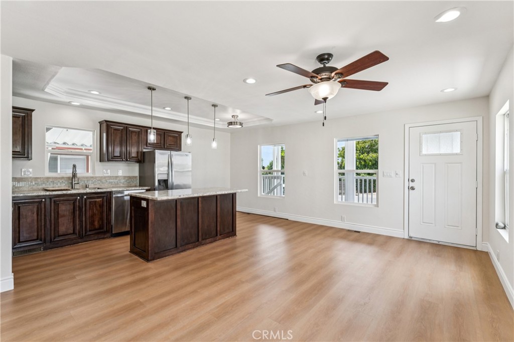 10550 Dunlap Crossing Road, Unit 141 Whittier, CA 90606 - Photo 7 of 38 a large kitchen with stainless steel appliances granite countertop a refrigerator a stove a sink dishwasher and a oven with large countertops