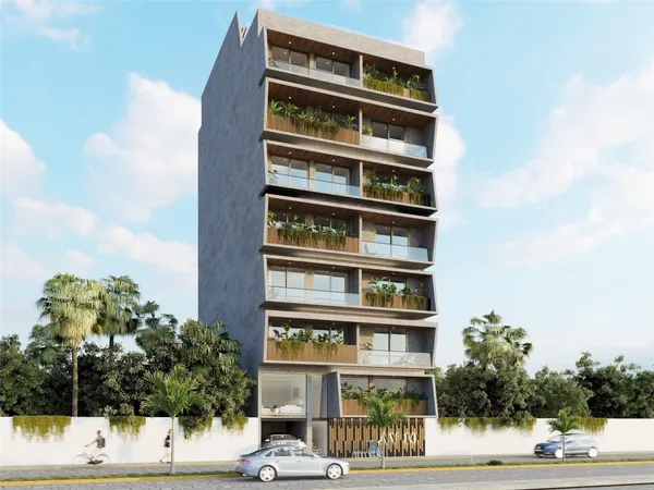 a front view of a building with a yard