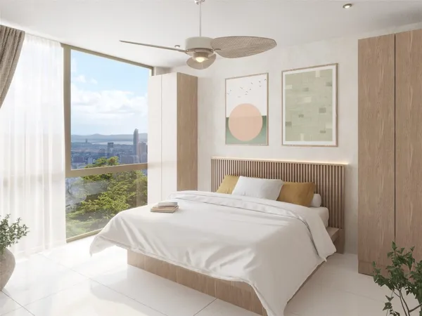 a bedroom with a large bed and a large window