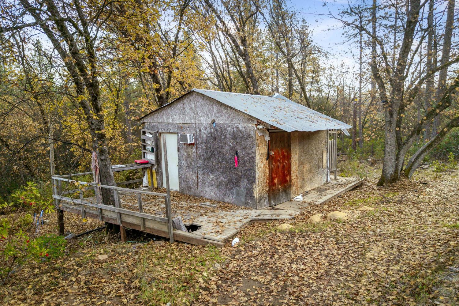 11838 Flying T Road Penn Valley, CA 95946 - Photo 10 of 42 a view of a house with a yard and wooden fence