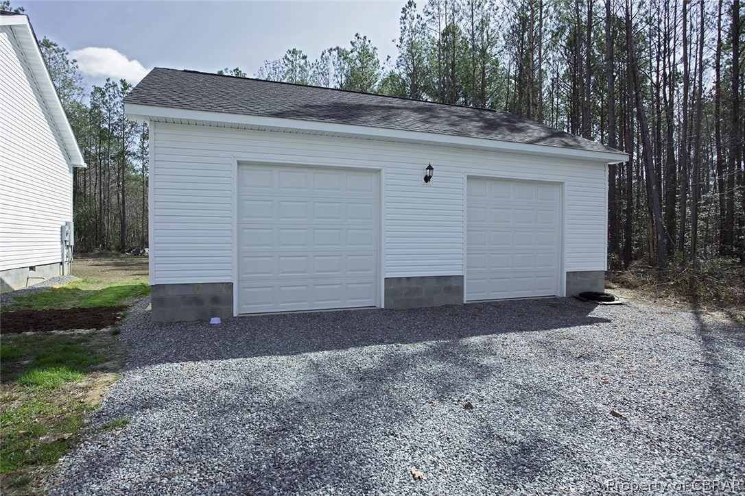 1496 Elsom Mascot Road Mattaponi, VA 23110 - Photo 3 of 33 a view of a house with a yard and garage