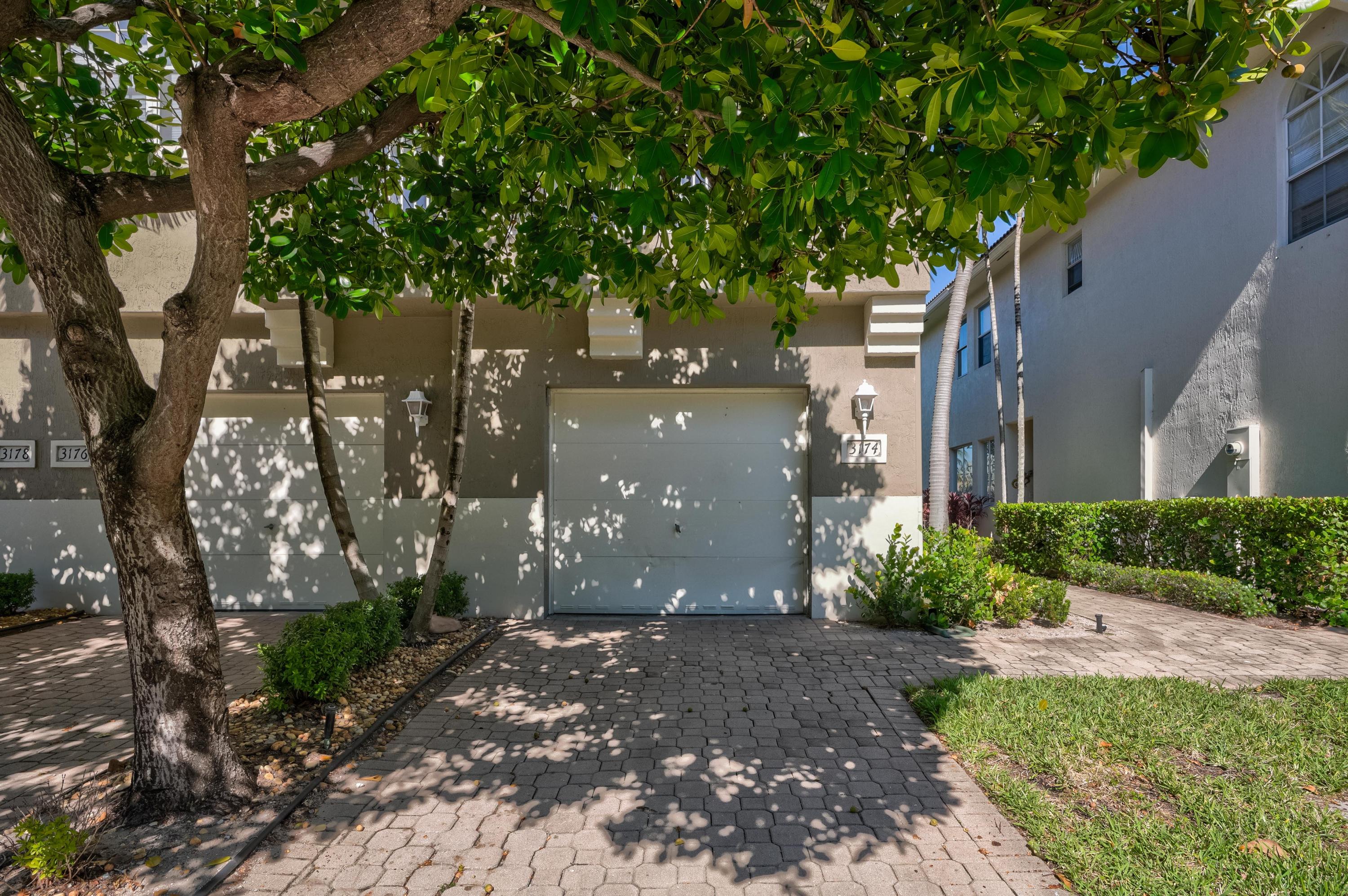 3174 Laurel Ridge Circle Riviera Beach, FL 33404 - Photo 29 of 32 a view of a back yard