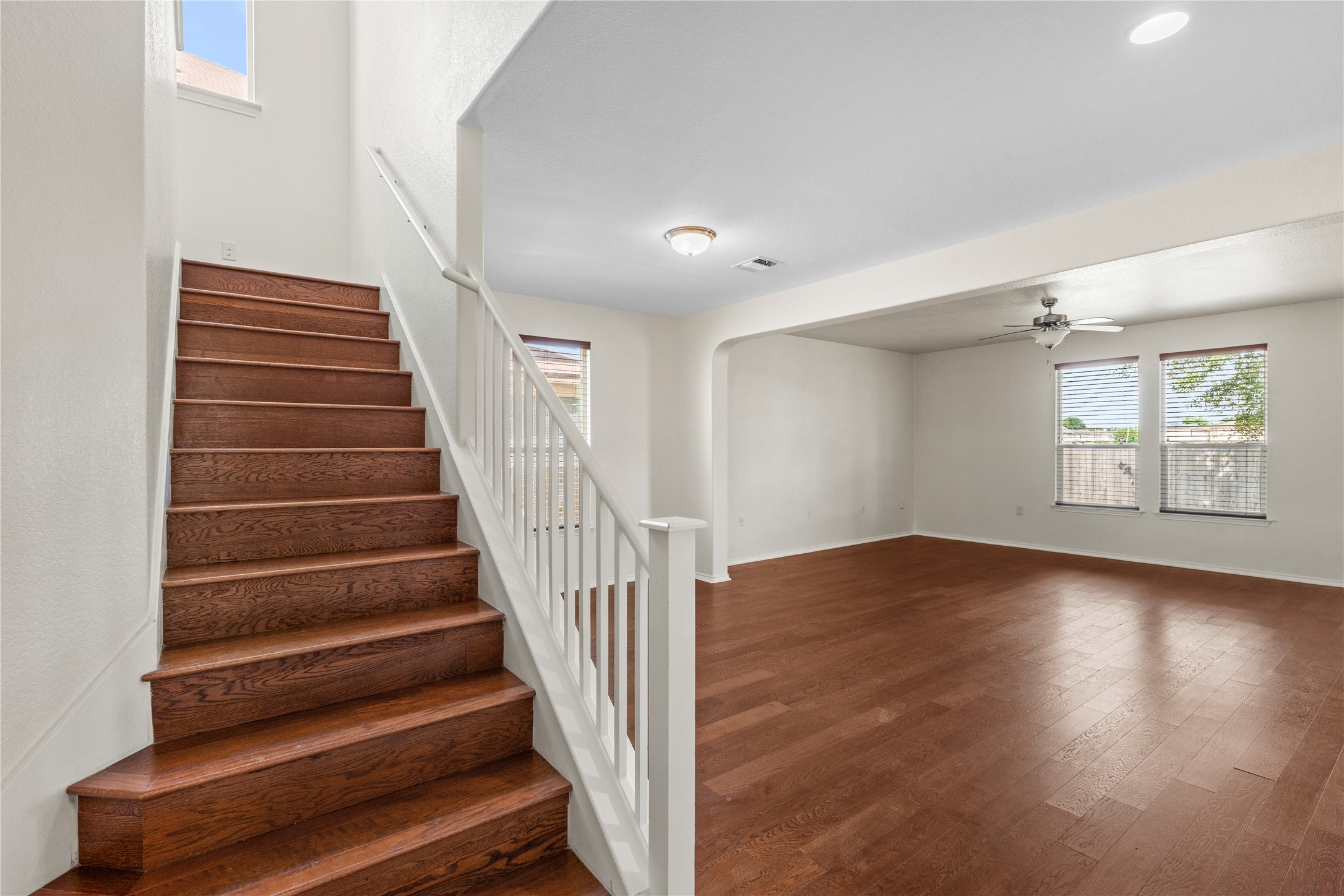 8613 Capitol View Drive Austin, TX 78747 - Photo 15 of 33 Rich hardwood floors welcome you to a spacious, naturally illuminated interior with a classic staircase.
