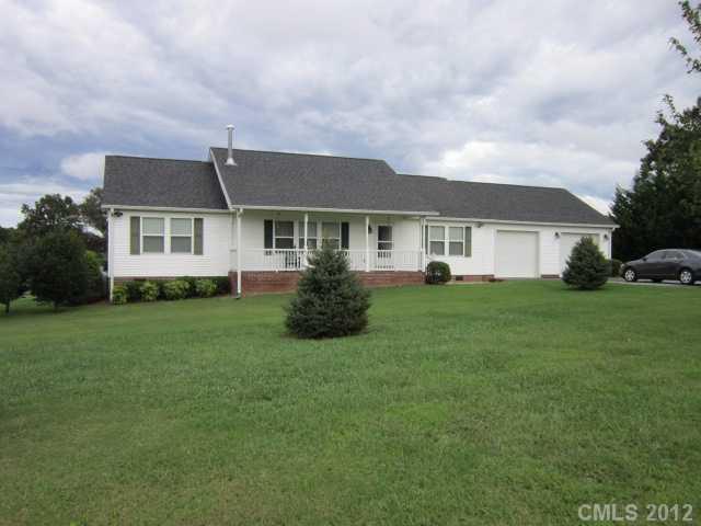 114 Rabbit Highway Harmony, NC 28634 - Photo 1 of 16 a front view of house with yard and green space