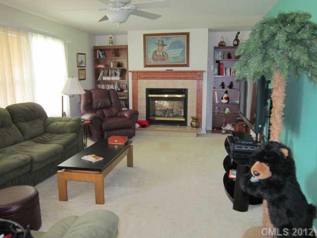 114 Rabbit Highway Harmony, NC 28634 - Photo 2 of 16 a living room with furniture and a fireplace