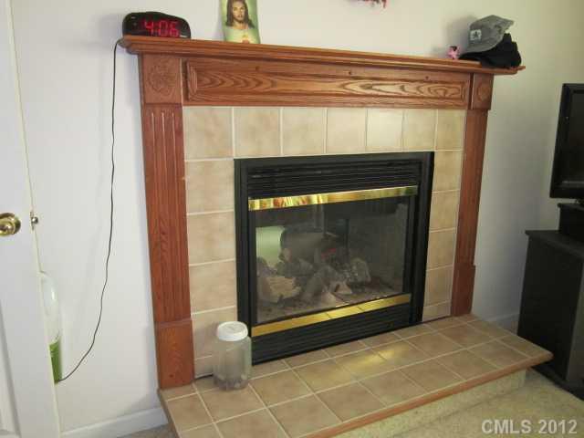 114 Rabbit Highway Harmony, NC 28634 - Photo 3 of 16 a living room with a fireplace