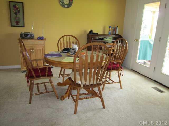 114 Rabbit Highway Harmony, NC 28634 - Photo 4 of 16 a view of a dining room with furniture and window