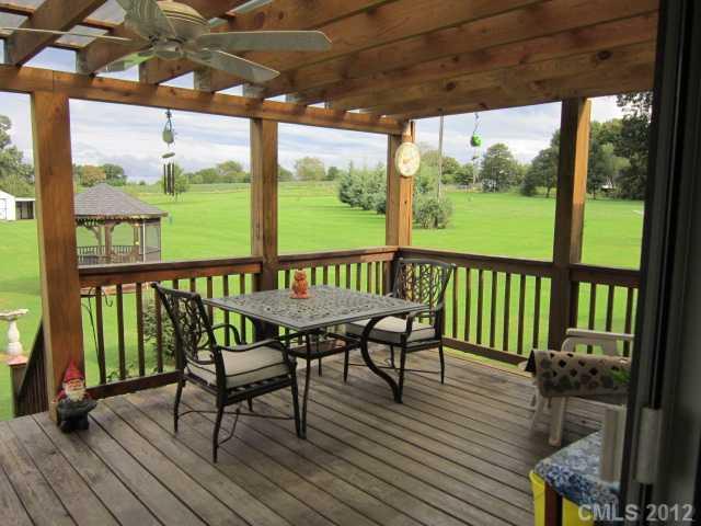 114 Rabbit Highway Harmony, NC 28634 - Photo 8 of 16 a view of a chairs on the roof deck