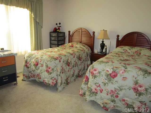 114 Rabbit Highway Harmony, NC 28634 - Photo 10 of 16 a bedroom with two beds and a chandelier