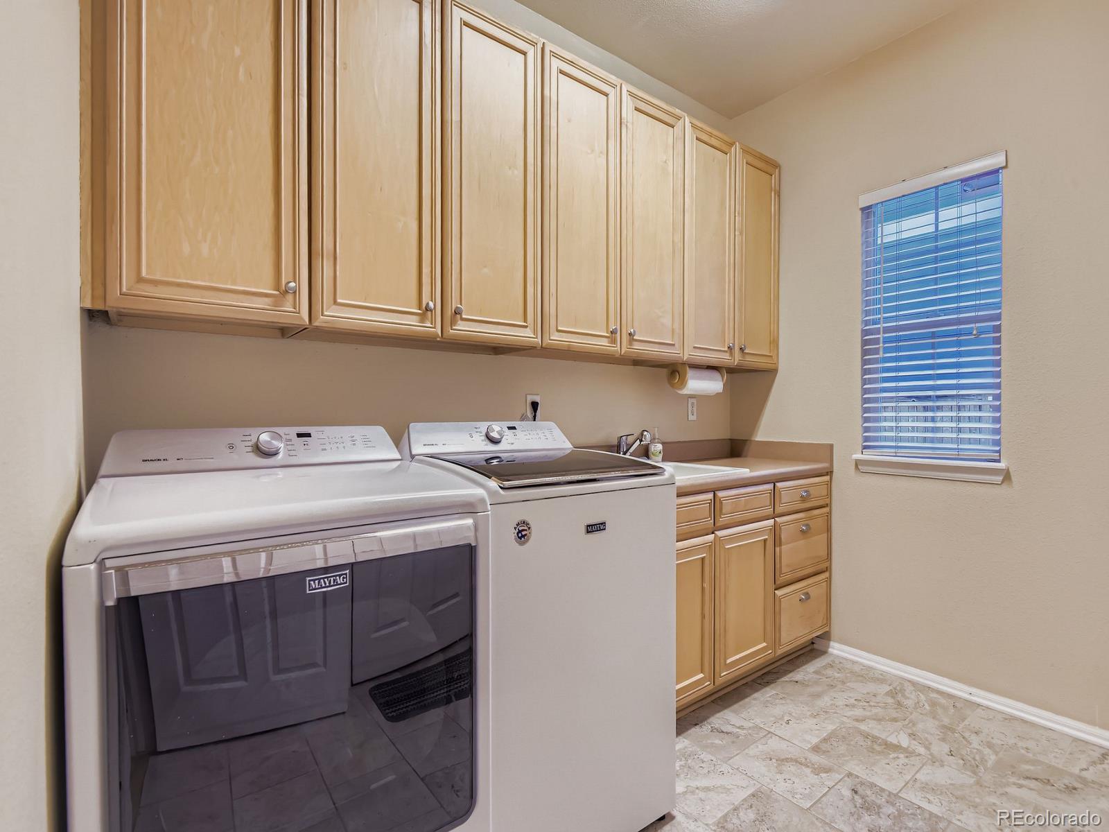10036 Brisbane Lane Highlands Ranch, CO 80130 - Photo 13 of 27 a utility room with dryer and washer