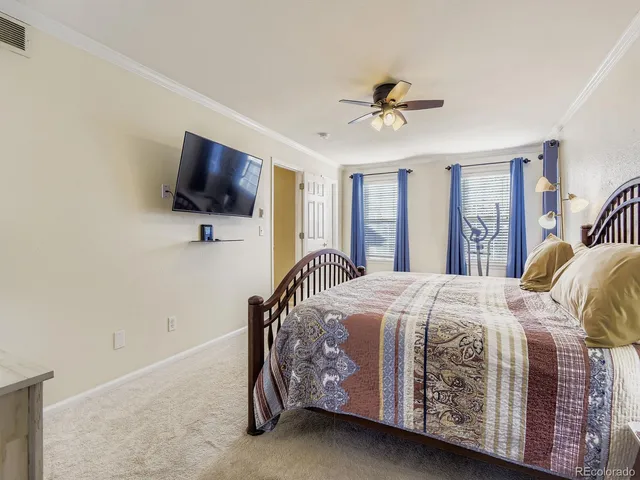 a view of walk in closet with clothes