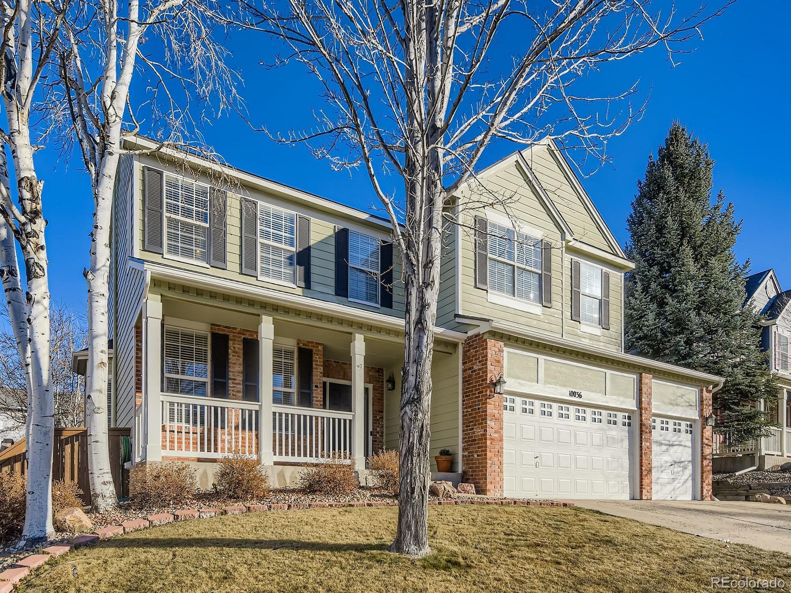 10036 Brisbane Lane Highlands Ranch, CO 80130 - Photo 2 of 27 a front view of a house