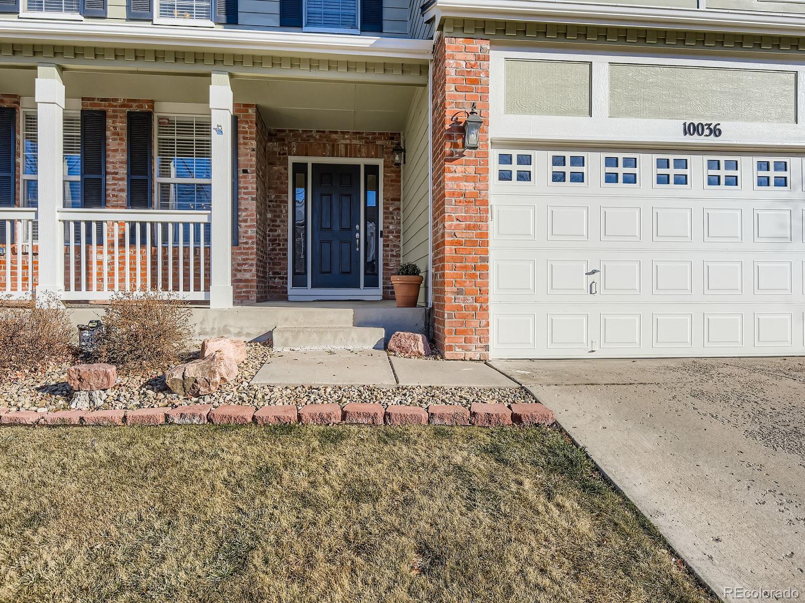 10036 Brisbane Lane Highlands Ranch, CO 80130 - Photo 3 of 27 a view of a house with a outdoor space
