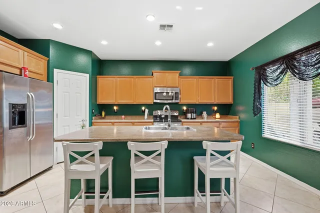 a livingroom with workspace and a window