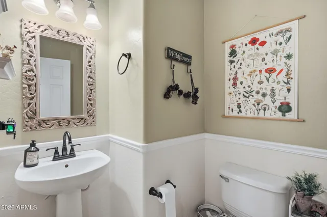 a view of walk in closet with clothes