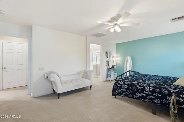 a view of storage and utility room with washer and dryer