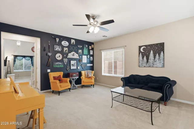 a living room with furniture and a table