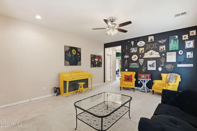 a living room with furniture and a rug
