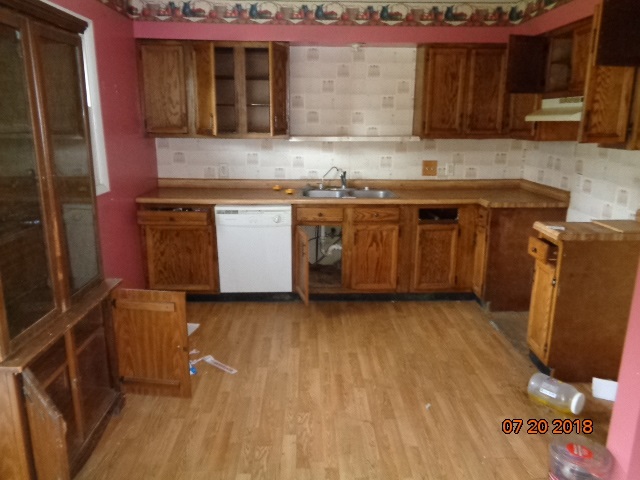 403 Scott Road Rochelle, IL 61068 - Photo 5 of 8 a kitchen with wooden cabinets and a stove