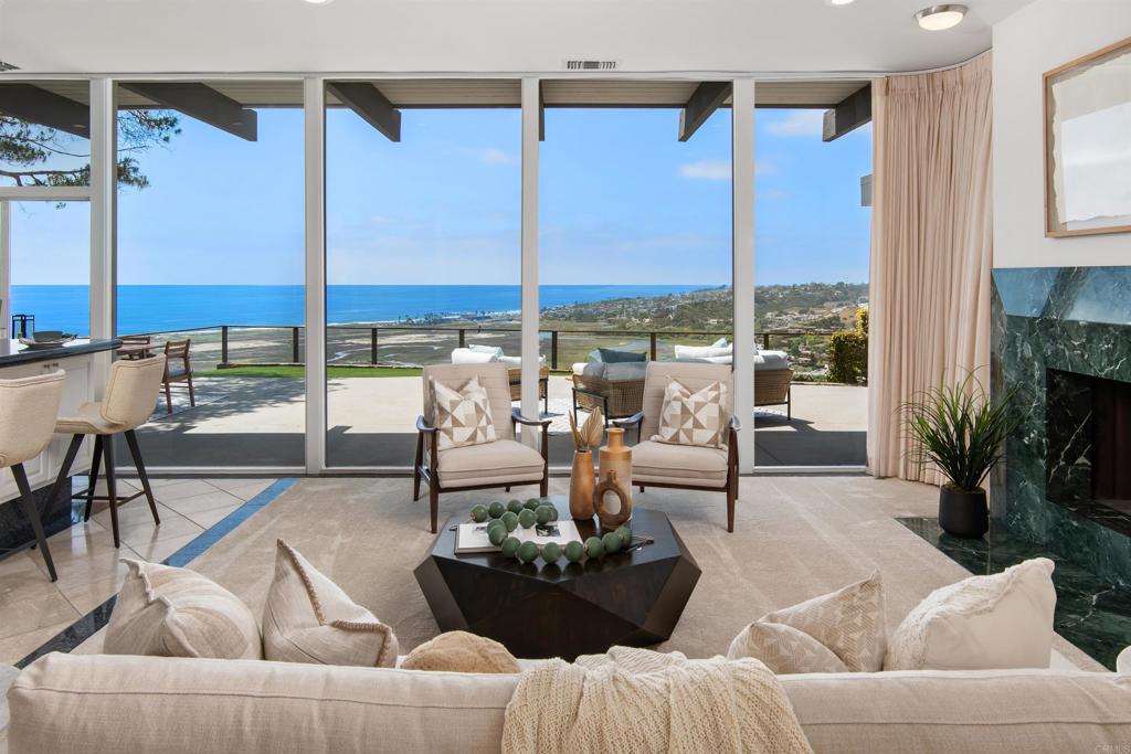 633 Canyon Place Solana Beach, CA 92075 - Photo 18 of 51 a living room with furniture and a floor to ceiling window