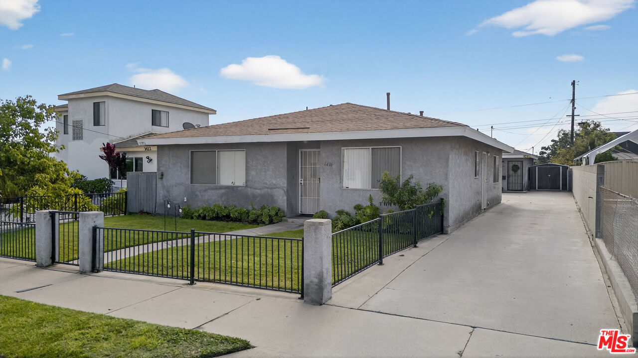 1416 255th Street Harbor City, CA 90710 - Photo 1 of 12 a front view of a house with a garden