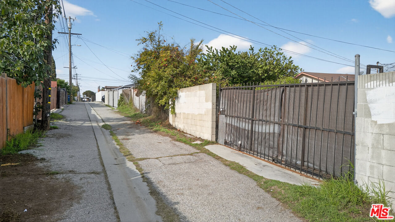1416 255th Street Harbor City, CA 90710 - Photo 11 of 12 a view of a backyard with wooden fence