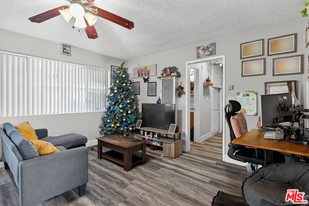1416 255th Street Harbor City, CA 90710 - Photo 9 of 12 a living room with furniture a piano and a window