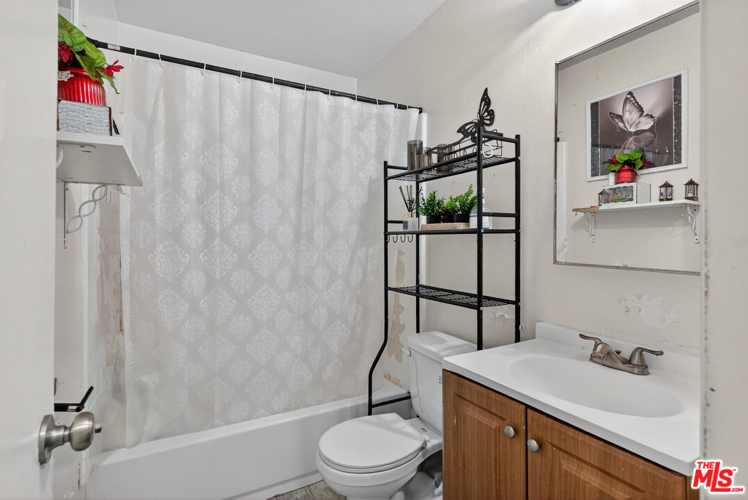 1416 255th Street Harbor City, CA 90710 - Photo 10 of 12 a bathroom with a sink toilet and shower