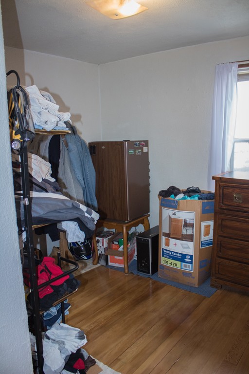 72 Whipple Street Fall River, MA 02721 - Photo 13 of 28 a view of walk in closet with clothes and shoes