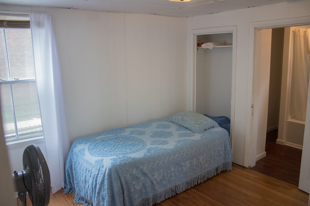 72 Whipple Street Fall River, MA 02721 - Photo 14 of 28 a bed sitting in a bedroom next to a window
