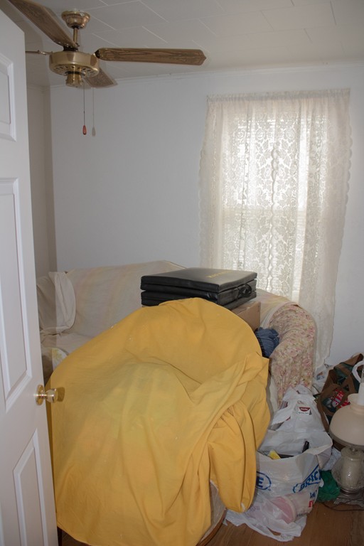 72 Whipple Street Fall River, MA 02721 - Photo 22 of 28 a bed sitting in a bedroom next to a window