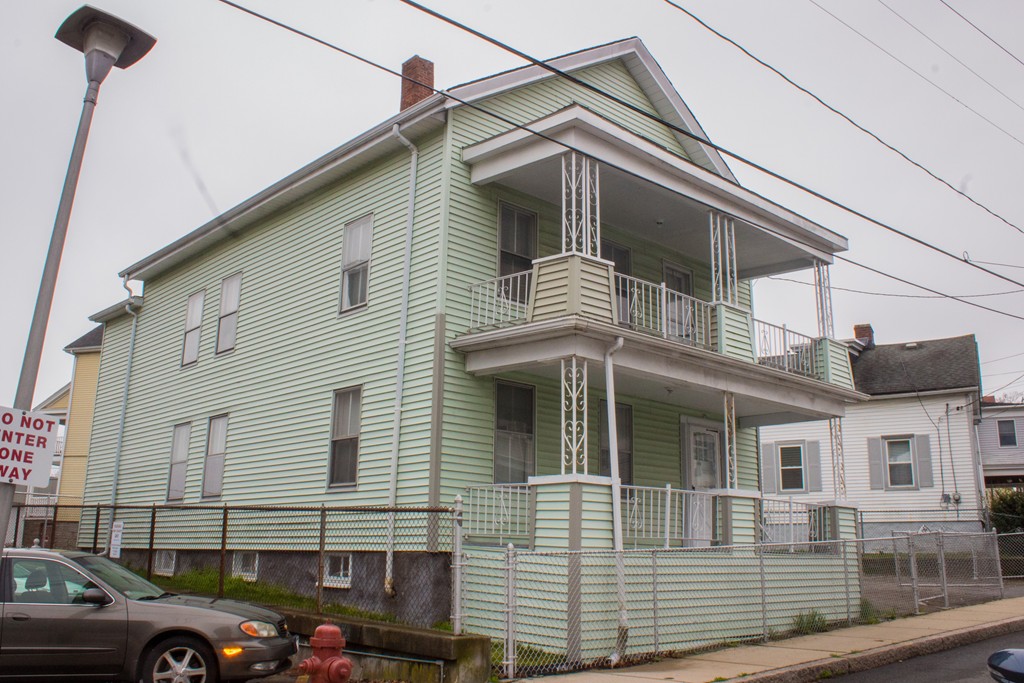 72 Whipple Street Fall River, MA 02721 - Photo 4 of 28 a front view of a house with a parking space