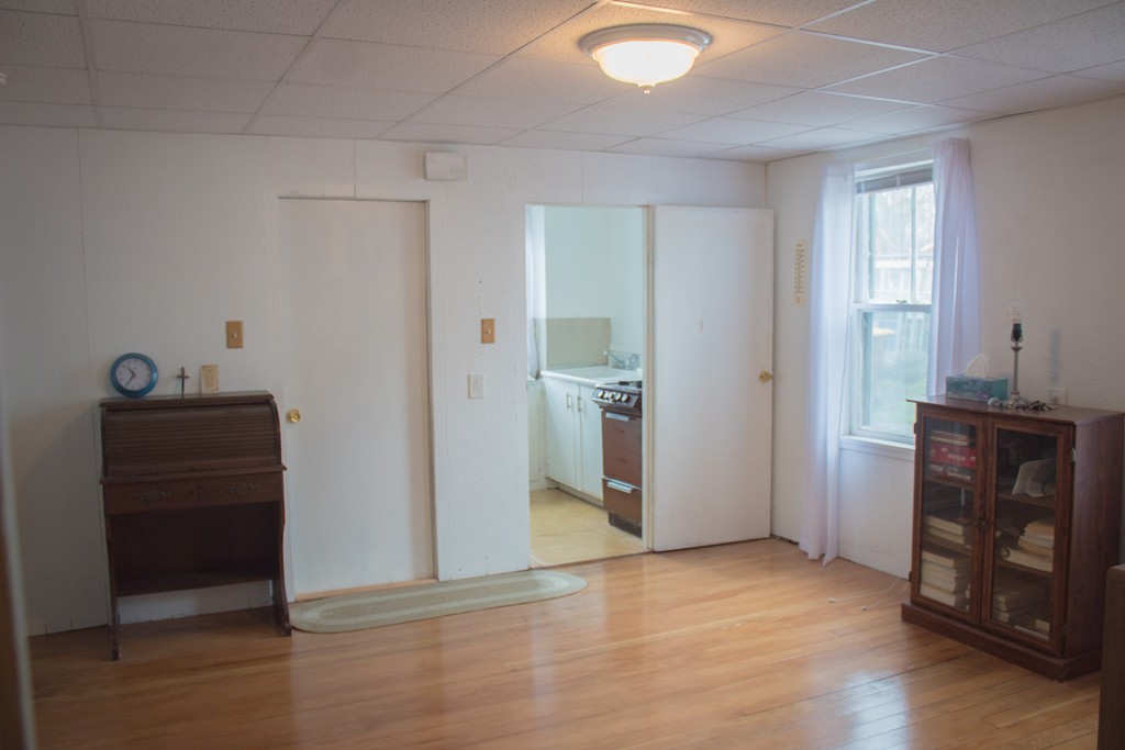 72 Whipple Street Fall River, MA 02721 - Photo 9 of 28 a view of empty room with wooden floor