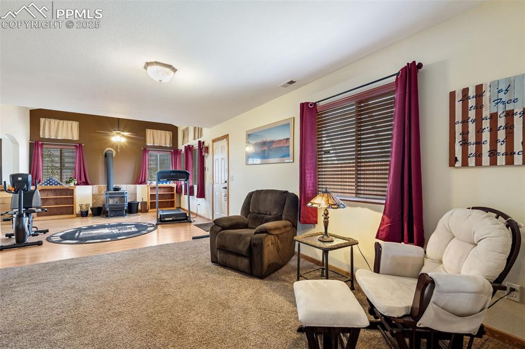 18895 Sage Crest Road Peyton, CO 80831 - Photo 22 of 38 a living room with furniture and a flat screen tv