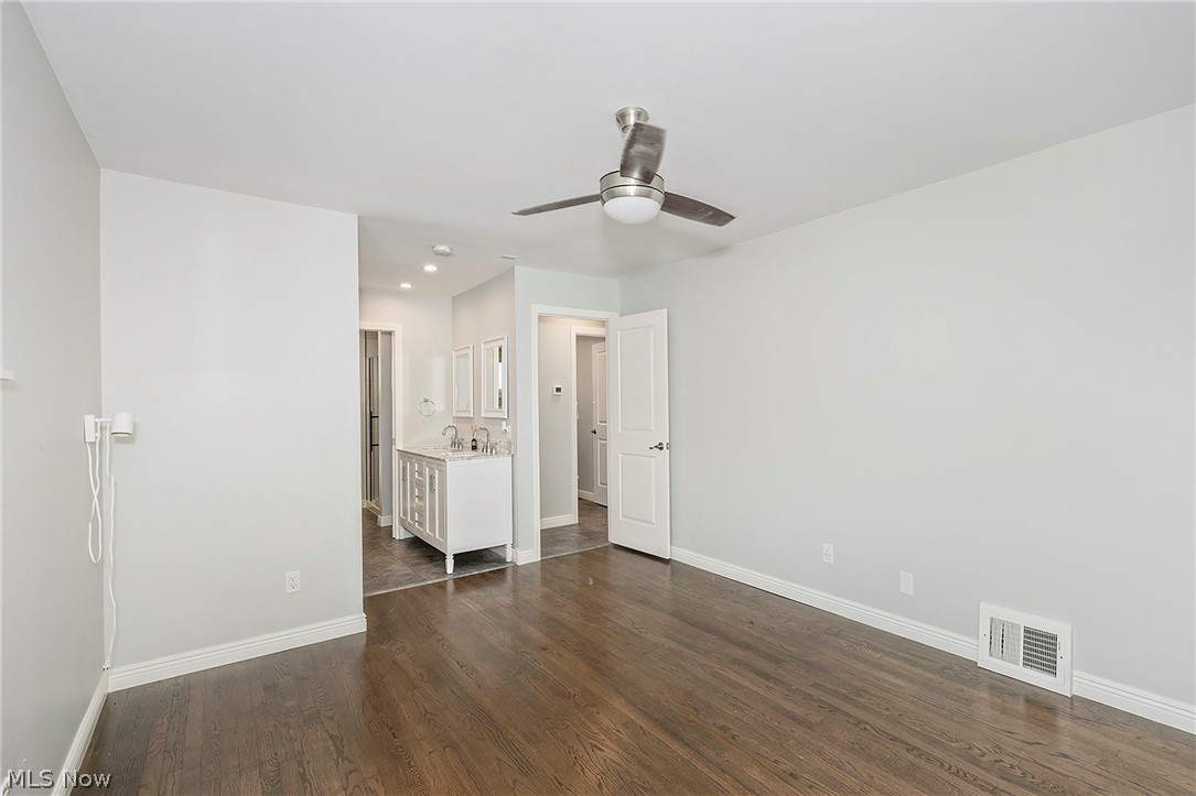 3719 Walter Road North Olmsted, OH 44070 - Photo 18 of 35 Spacious room featuring rich wood-finish flooring, a contemporary ceiling fan, and crisp white baseboards