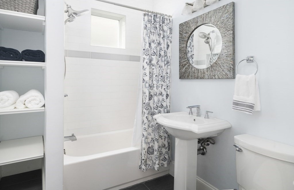 33 Bay State Avenue, Unit 1 Somerville, MA 02144 - Photo 16 of 23 a bathroom with a sink toilet and shower