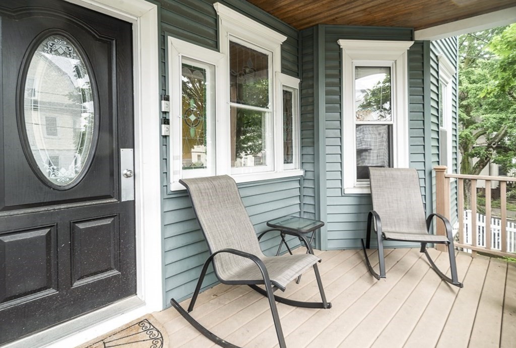 33 Bay State Avenue, Unit 1 Somerville, MA 02144 - Photo 2 of 23 a view of a two chairs in a patio