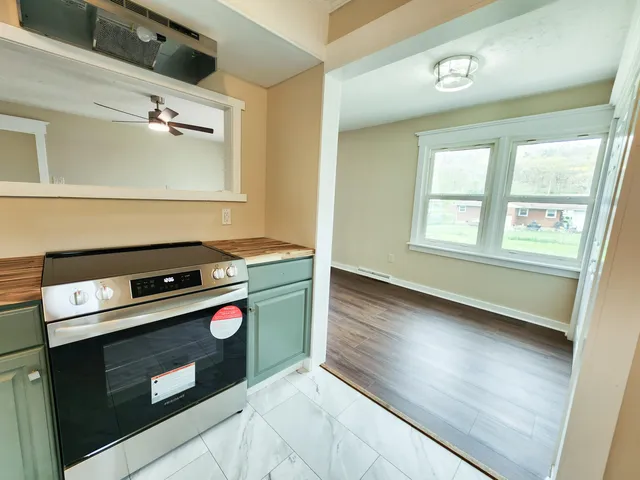 a bathroom with a sink a mirror and a shower