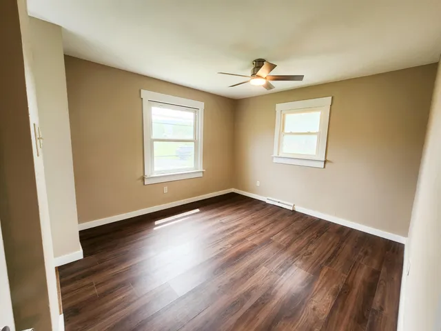 a view of backyard with a barn and a cactus plant