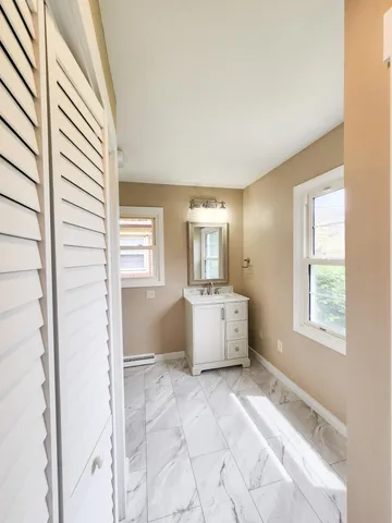 a balcony with view of trees in the background