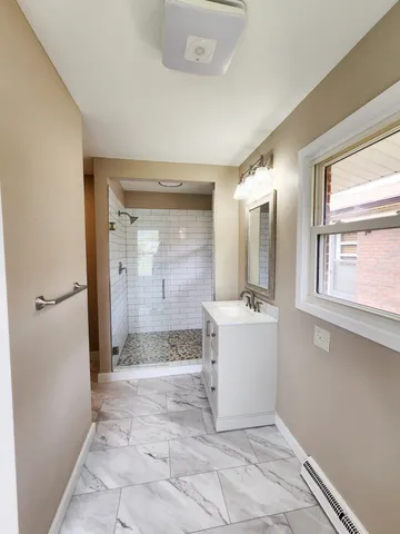 a view of a patio with wooden floor and a yard