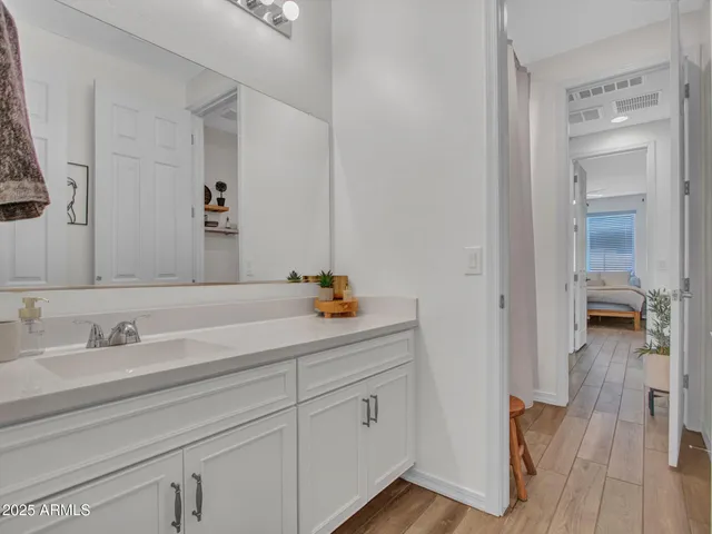 a en suite bathroom with a sink and mirror