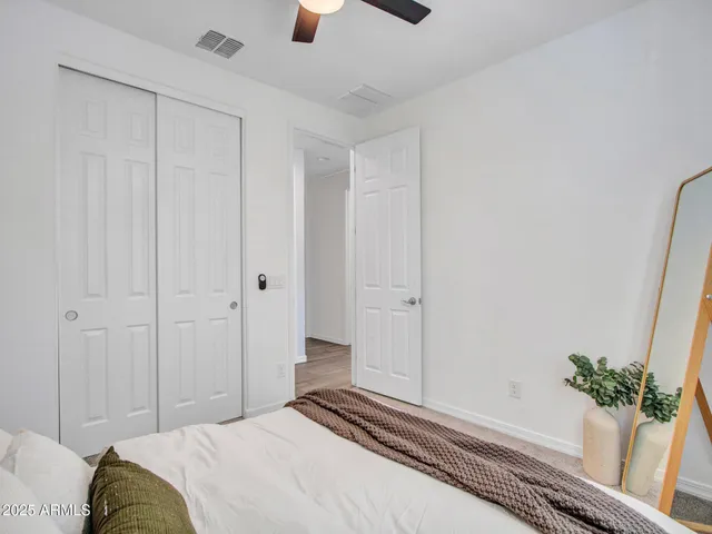 a view of a porch with a table and chairs