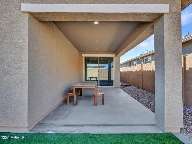 a backyard of a house with wooden fence