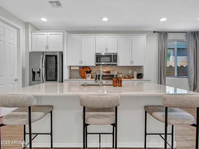 a view of a kitchen with sink cabinets and a window