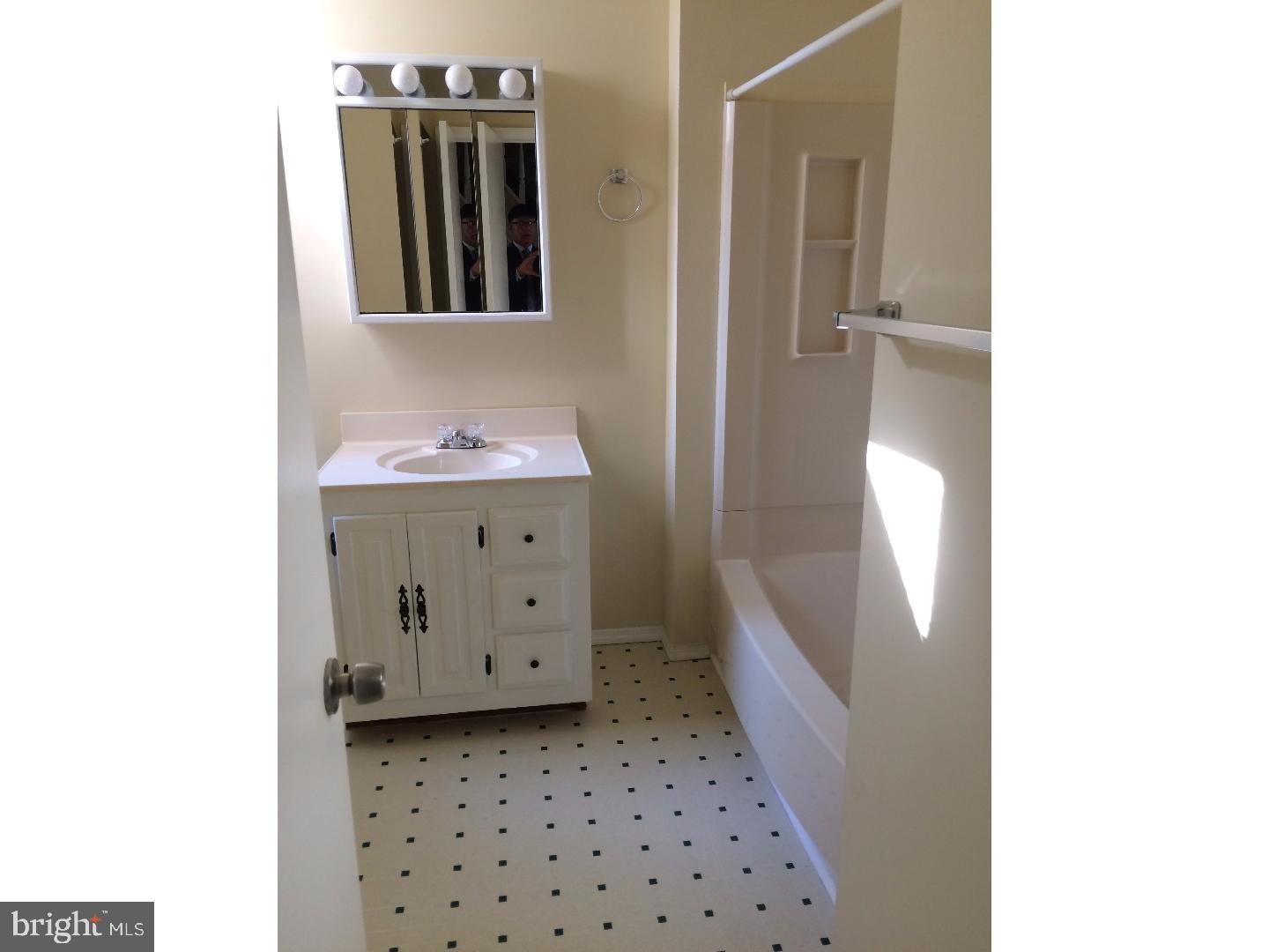 2025 South 3rd Street, Unit 3 Philadelphia, PA 19148 - Photo 6 of 7 a bathroom with a bathtub and a sink