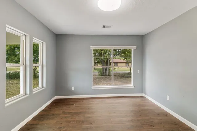 a view of an empty room with a window